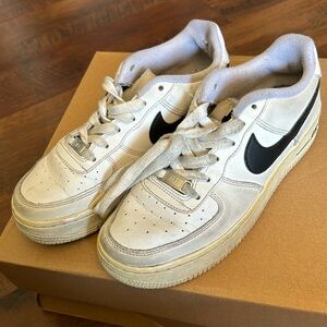 Air Force 1’s white and black sneakers